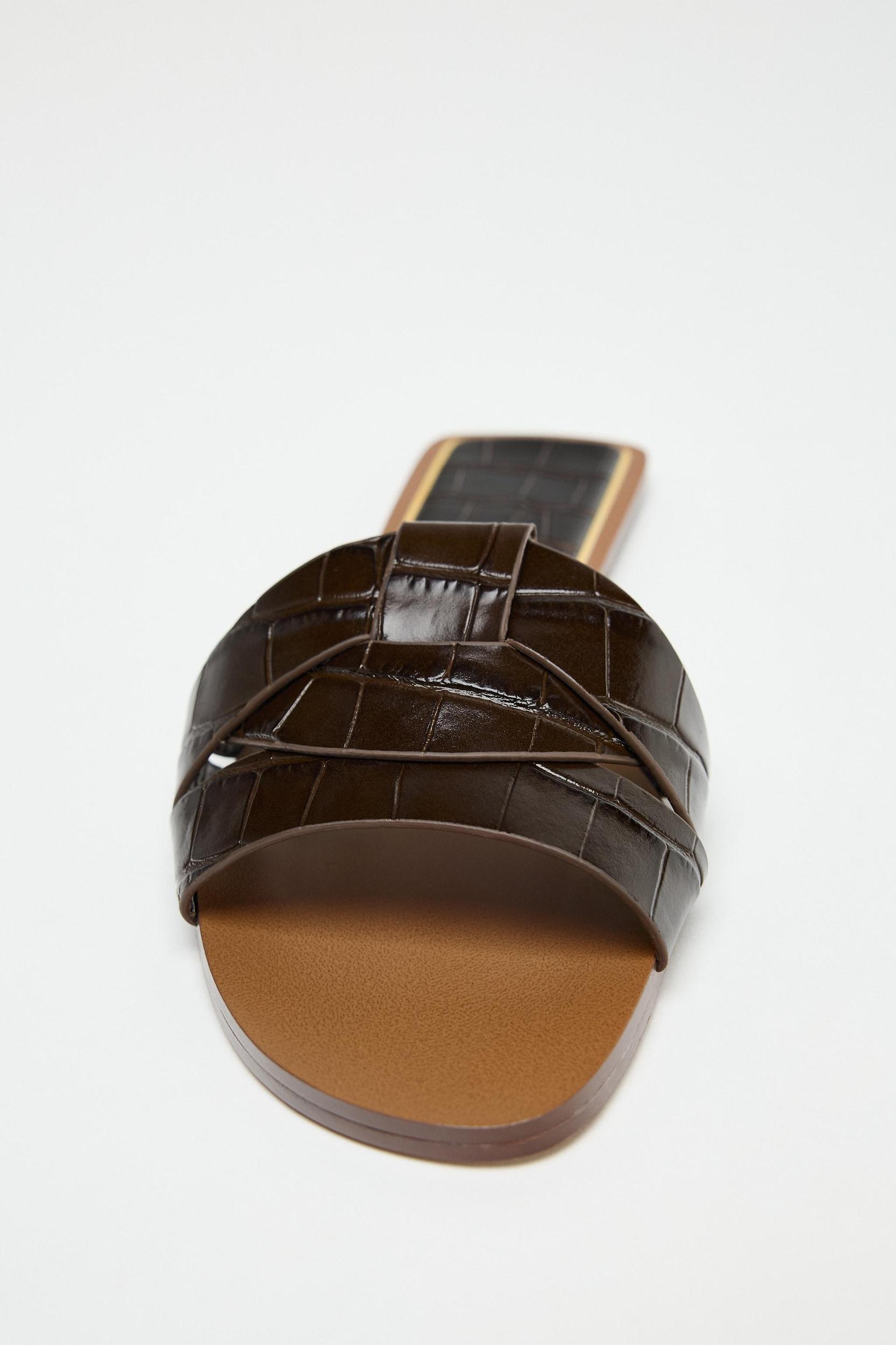 EMBOSSED LEATHER FLAT SANDALS Product Image