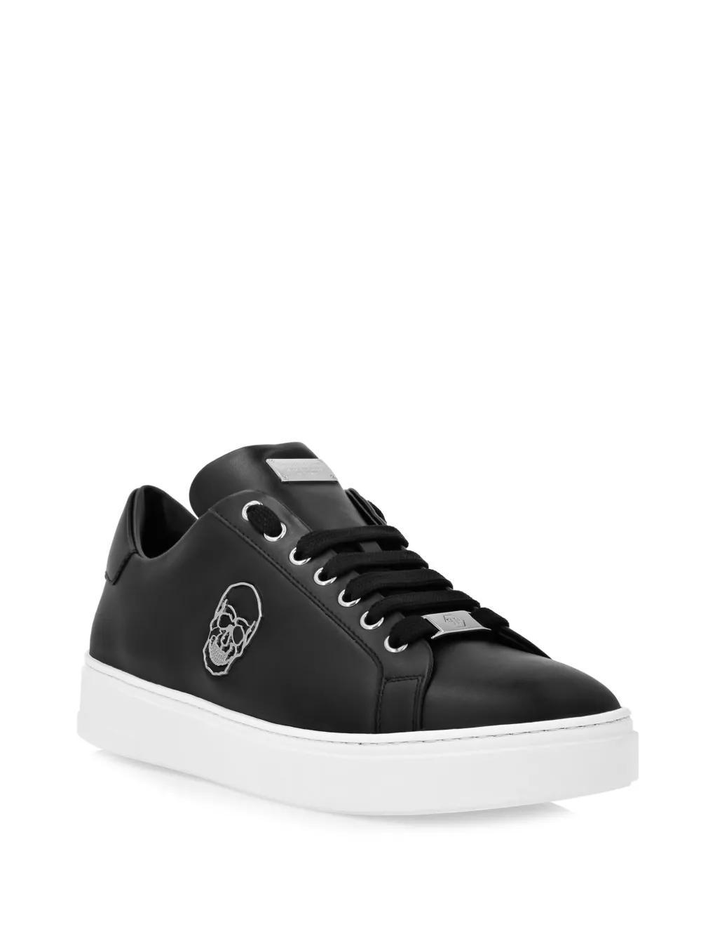 Skull-appliqué leather sneakers Product Image