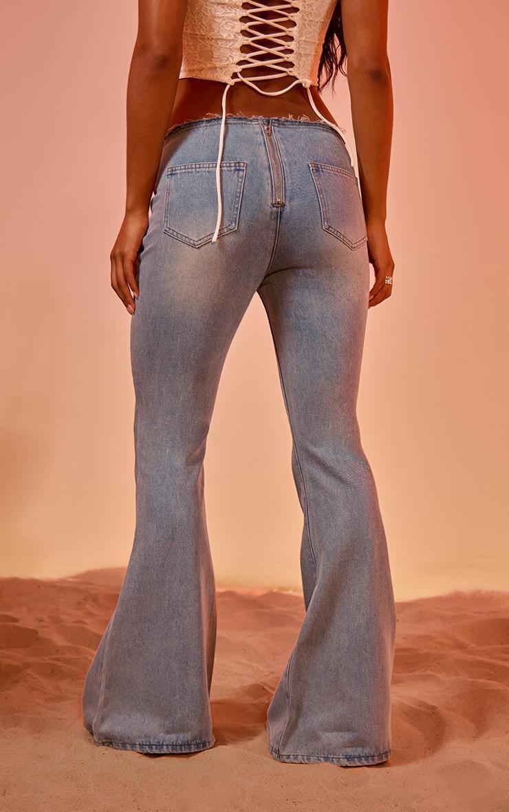 Light Blue Vintage Wash Front Frayed Seam Lace Up Detail Flared Jeans Product Image