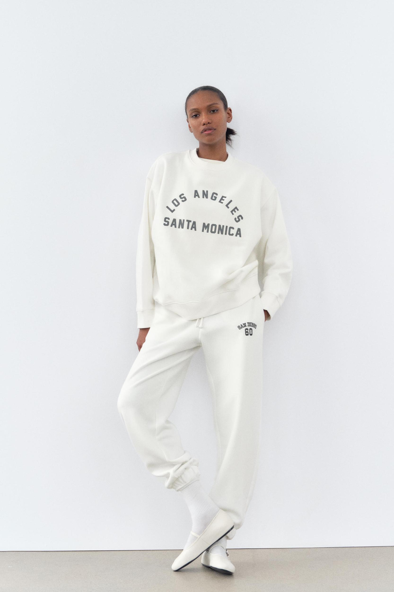 WASHED EFFECT RUBBERIZED TEXT SWEATSHIRT Product Image