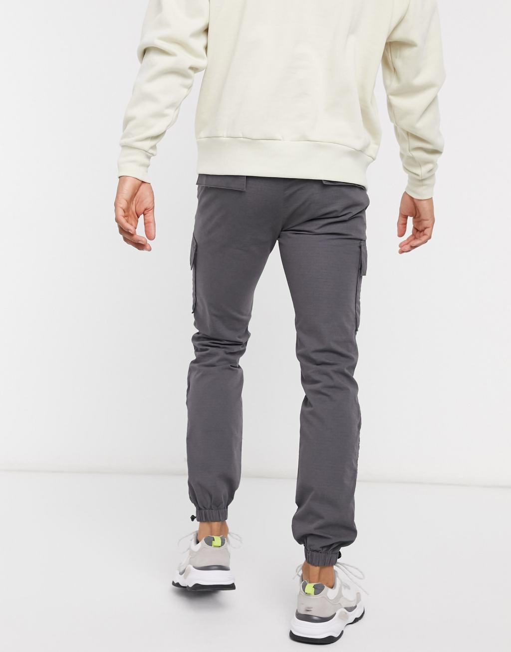 ASOS DESIGN slim cargo pants with toggle hem Product Image