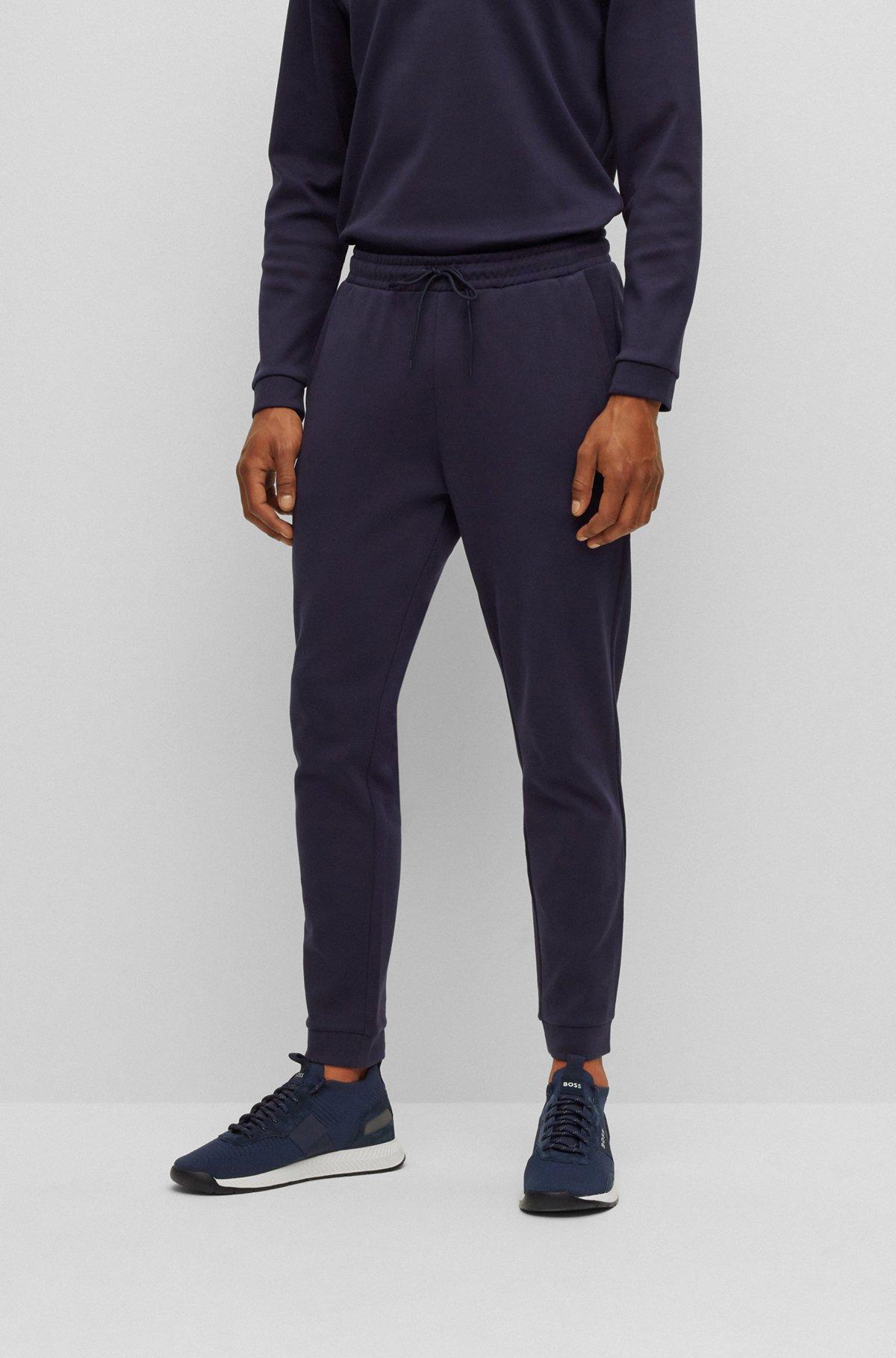 Cotton tracksuit bottoms with curved logo Product Image