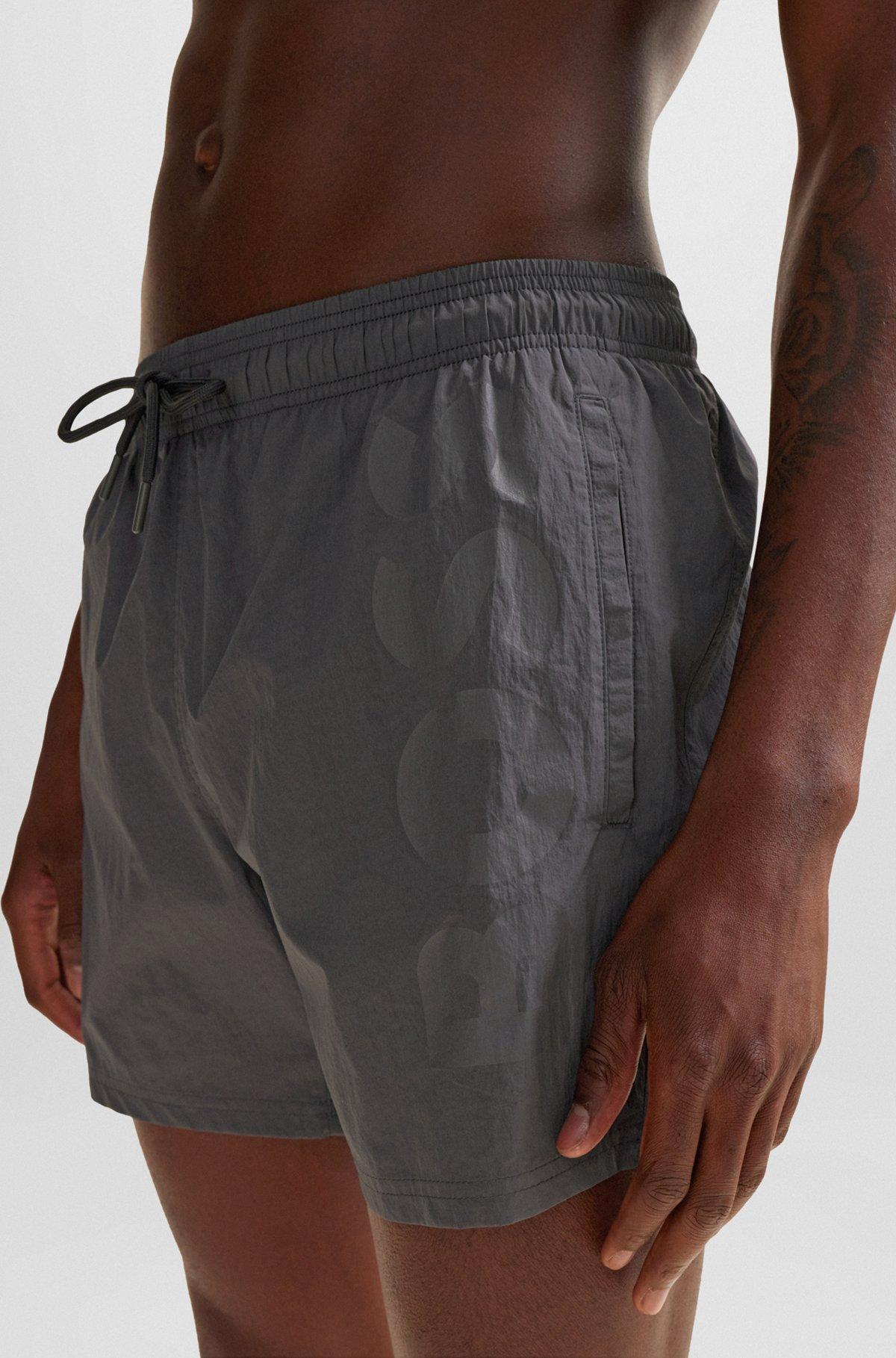 Quick-dry swim shorts with large logo print Product Image