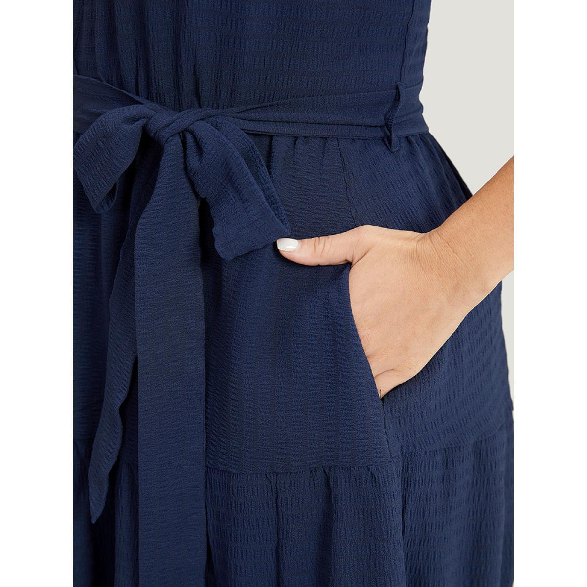 Plus Size Solid Knot Halter Pocket Belted Ruffles Tiered Hem Dress Indigo Women Elegant Gathered Halter neck Sleeveless Curvy Knee Dress BloomChic 18-20/2X Product Image