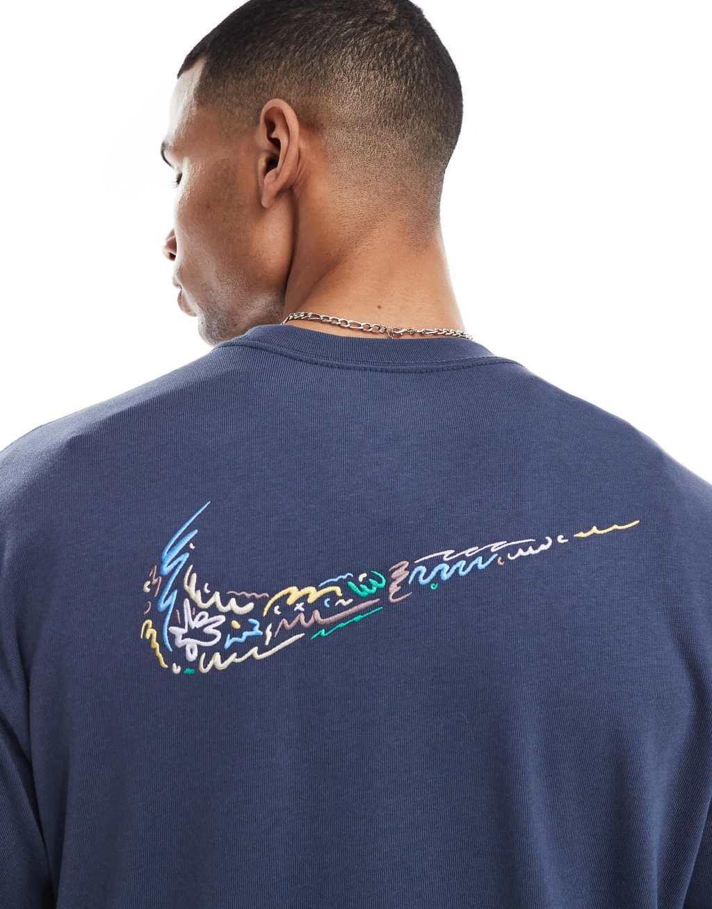 Nike Doodle Swoosh graphic longsleeve t-shirt in dark blue Product Image