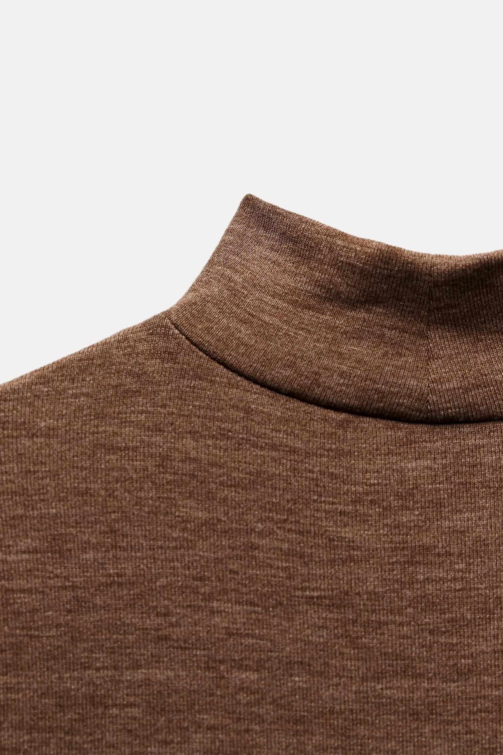 Midi turtleneck dress with long sleeves. A-line silhouette. Product Image