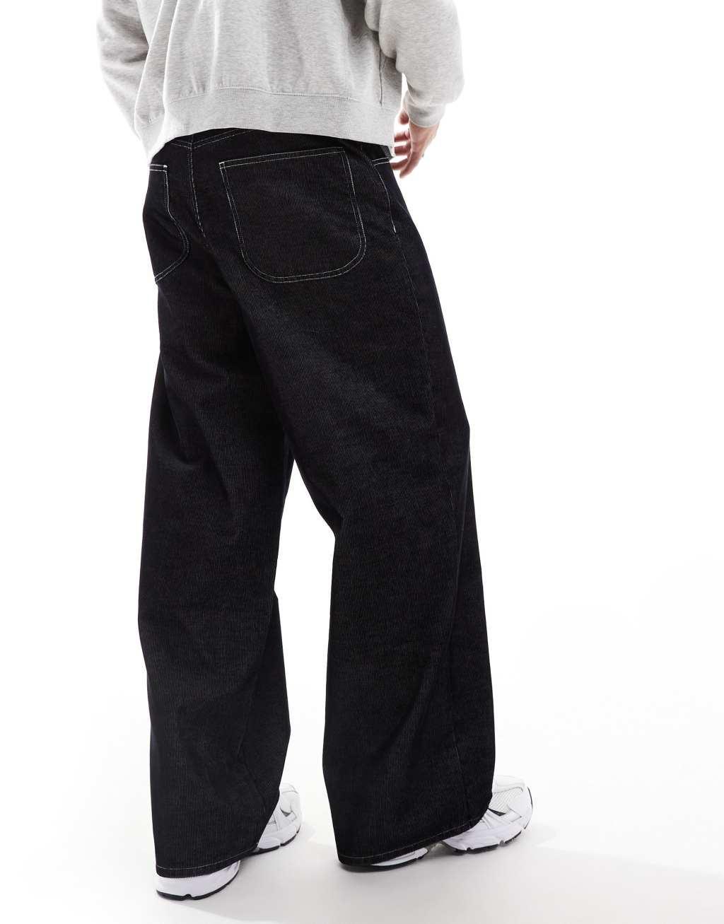 ASOS DESIGN super baggy corduroy pants with contrast stitch in black Product Image