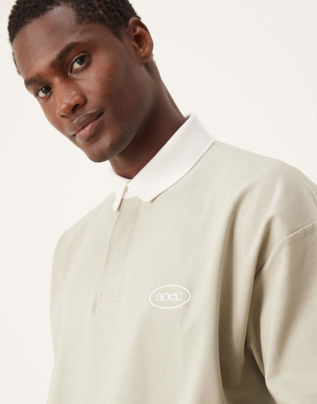 ASOS DESIGN oversized boxy polo in heavyweight 300gsm stone with chest print Product Image