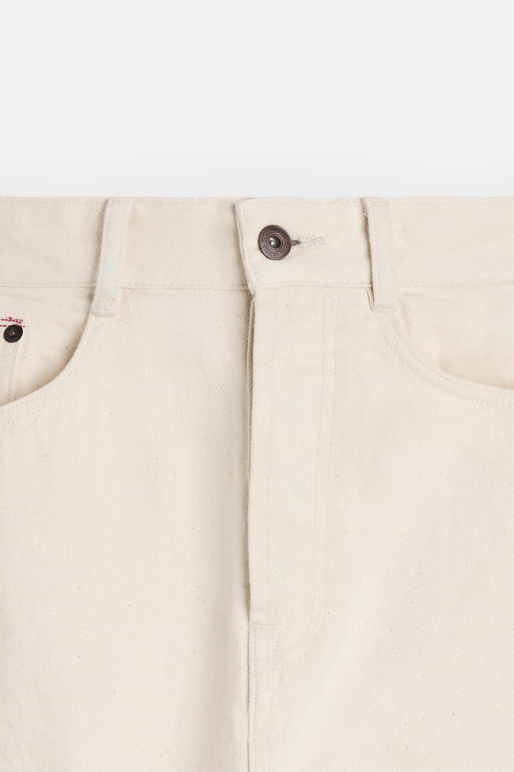 Slim fit jeans. Five pockets. Tonal topstitching. Front button closure.<br/><br/>Origins special collection. Product Image