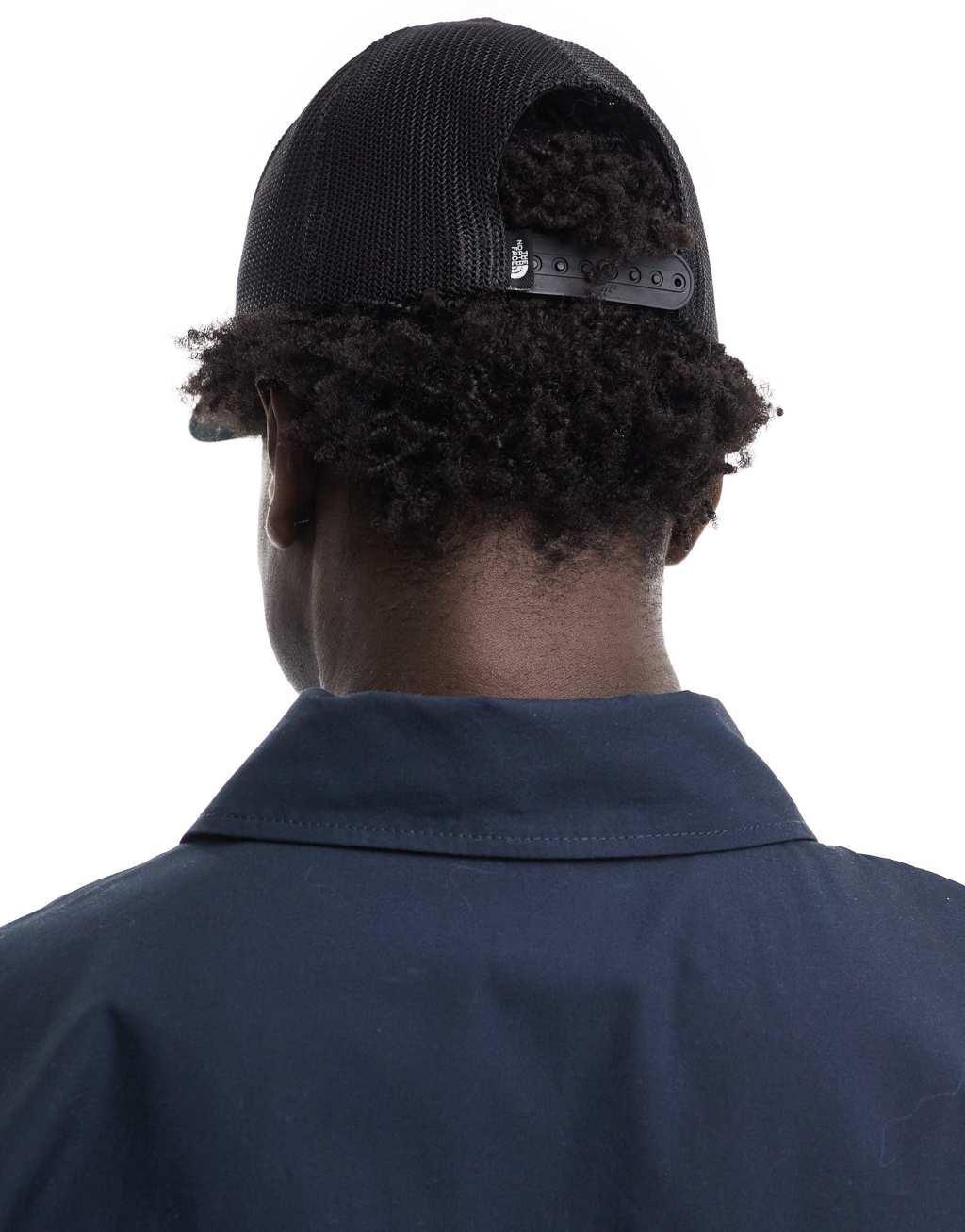 The North Face keep it patched trucker hat in black and white with red detail Product Image