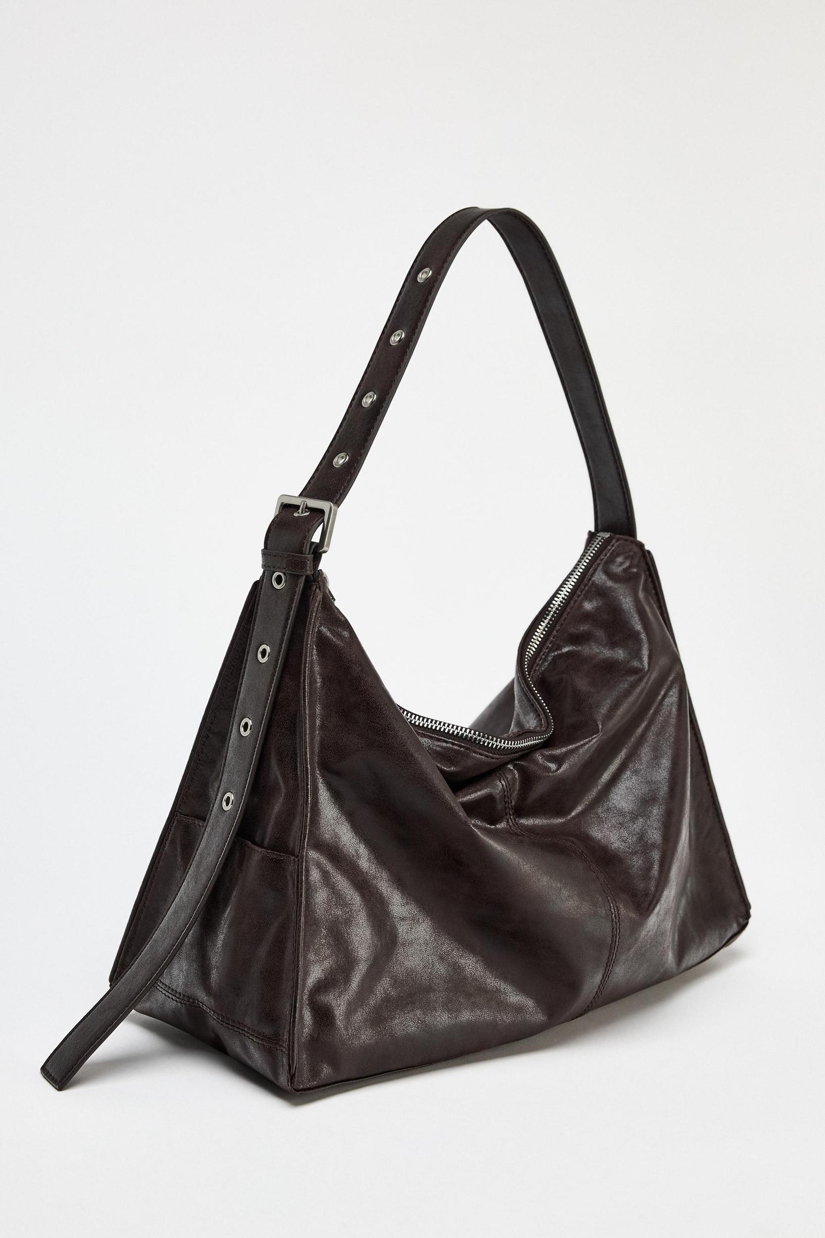 LARGE SOFT BUCKET BAG WITH METAL EYELETS Product Image