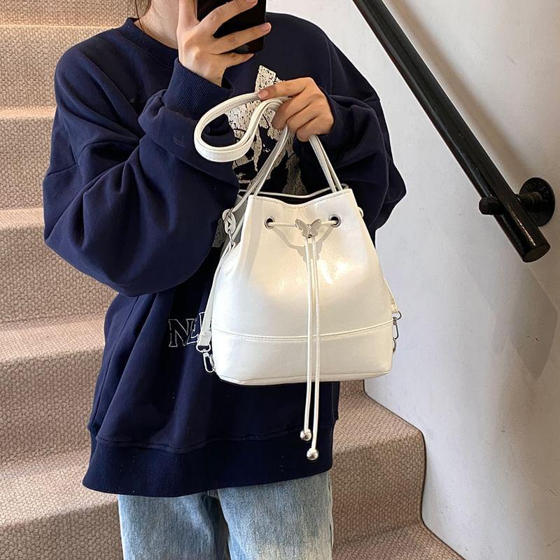 Butterfly Accent Drawstring Faux Leather Bucket Bag Product Image