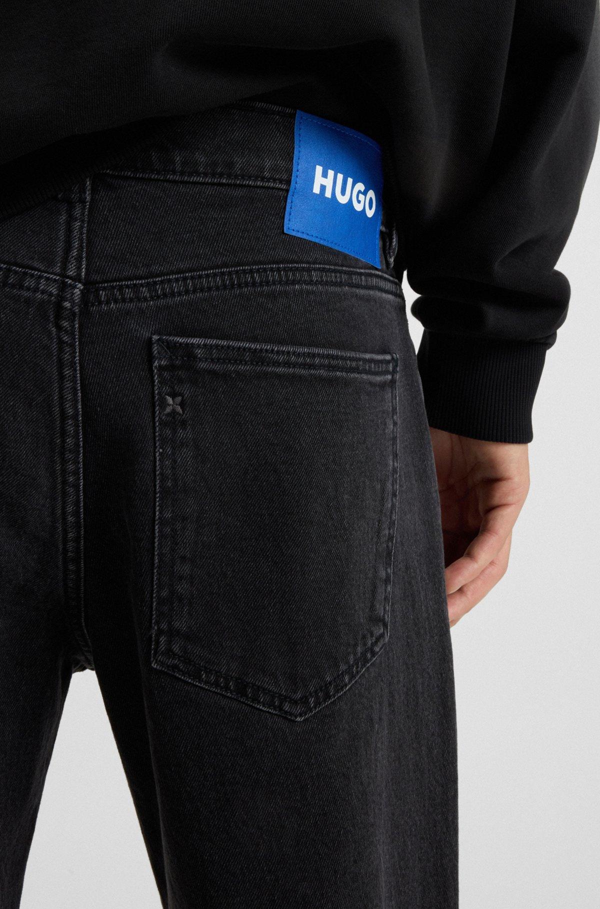 Tapered-fit jeans in grain-effect black denim Product Image
