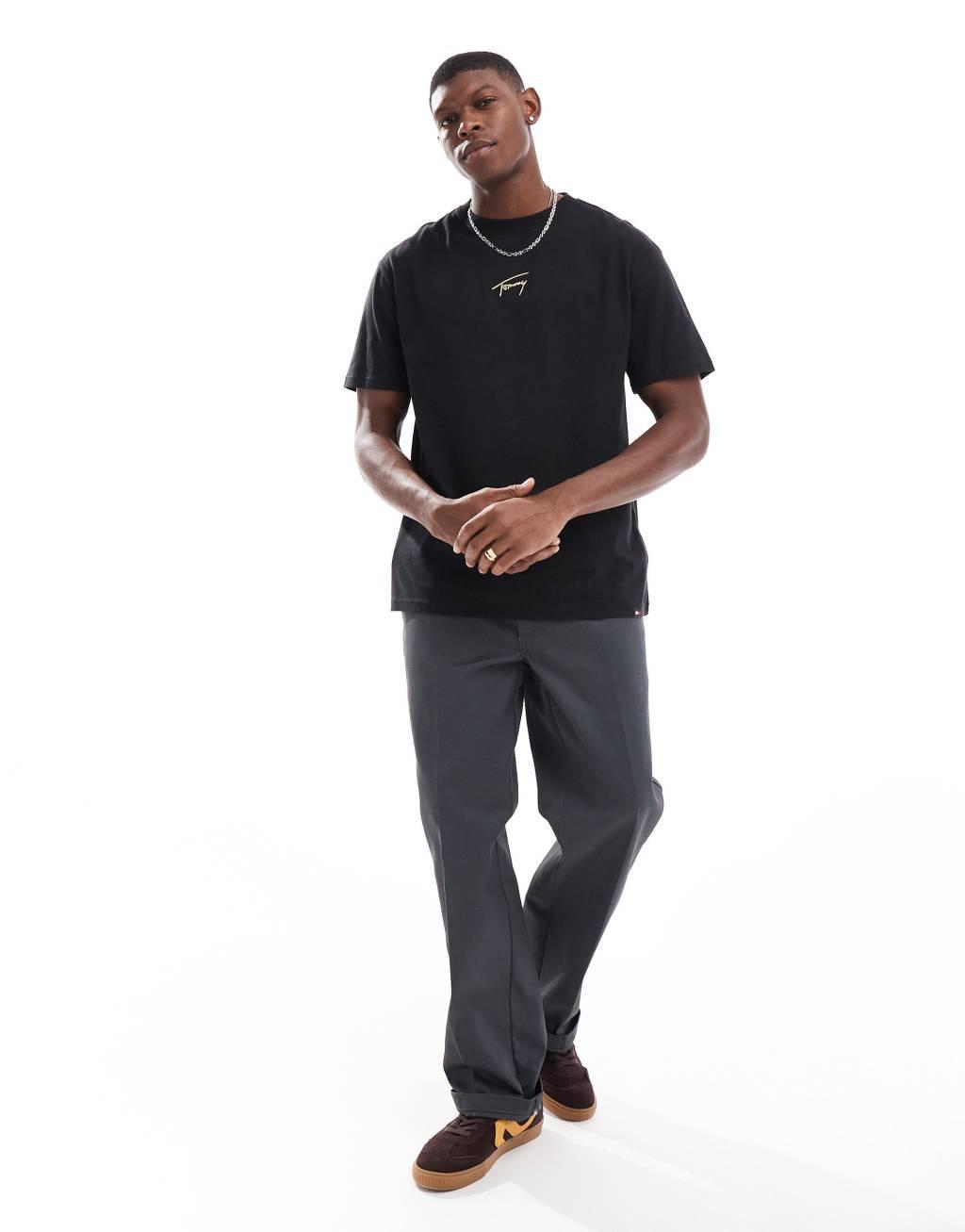 Tommy Jeans gold central logo t-shirt in black Product Image
