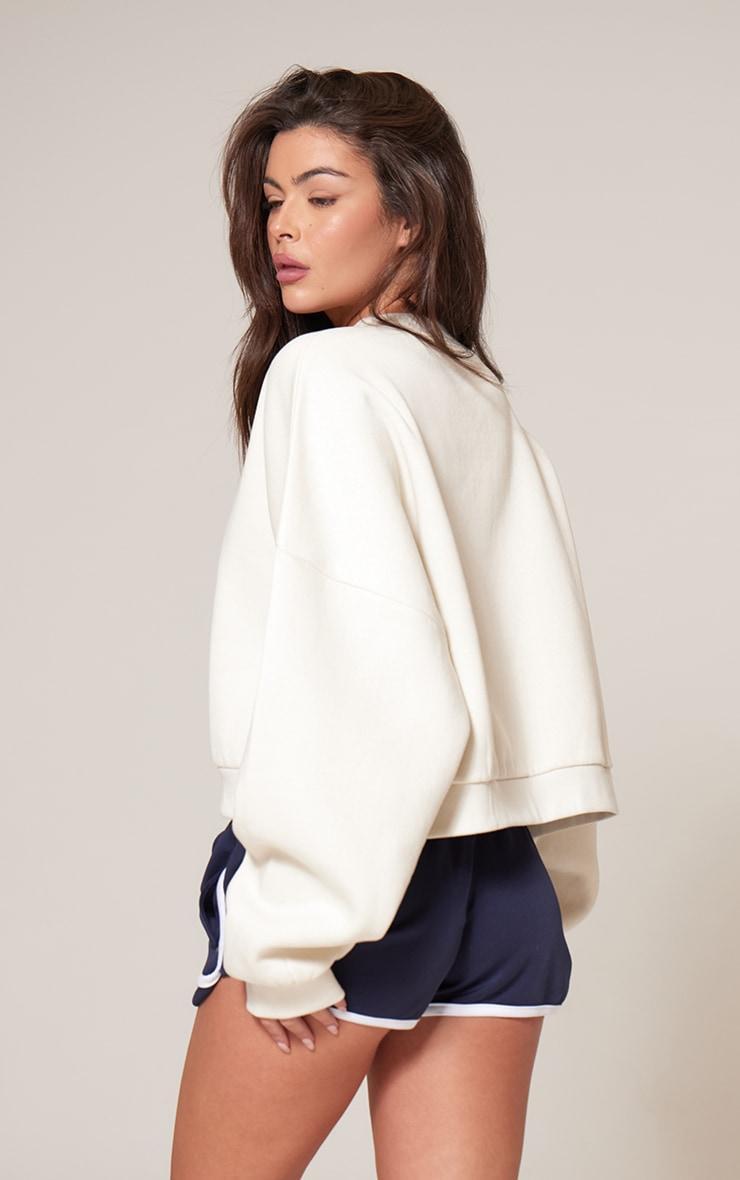 PRETTYLITTLETHING Cream Athletics Club Embossed Oversized Boxy Sweatshirt Product Image
