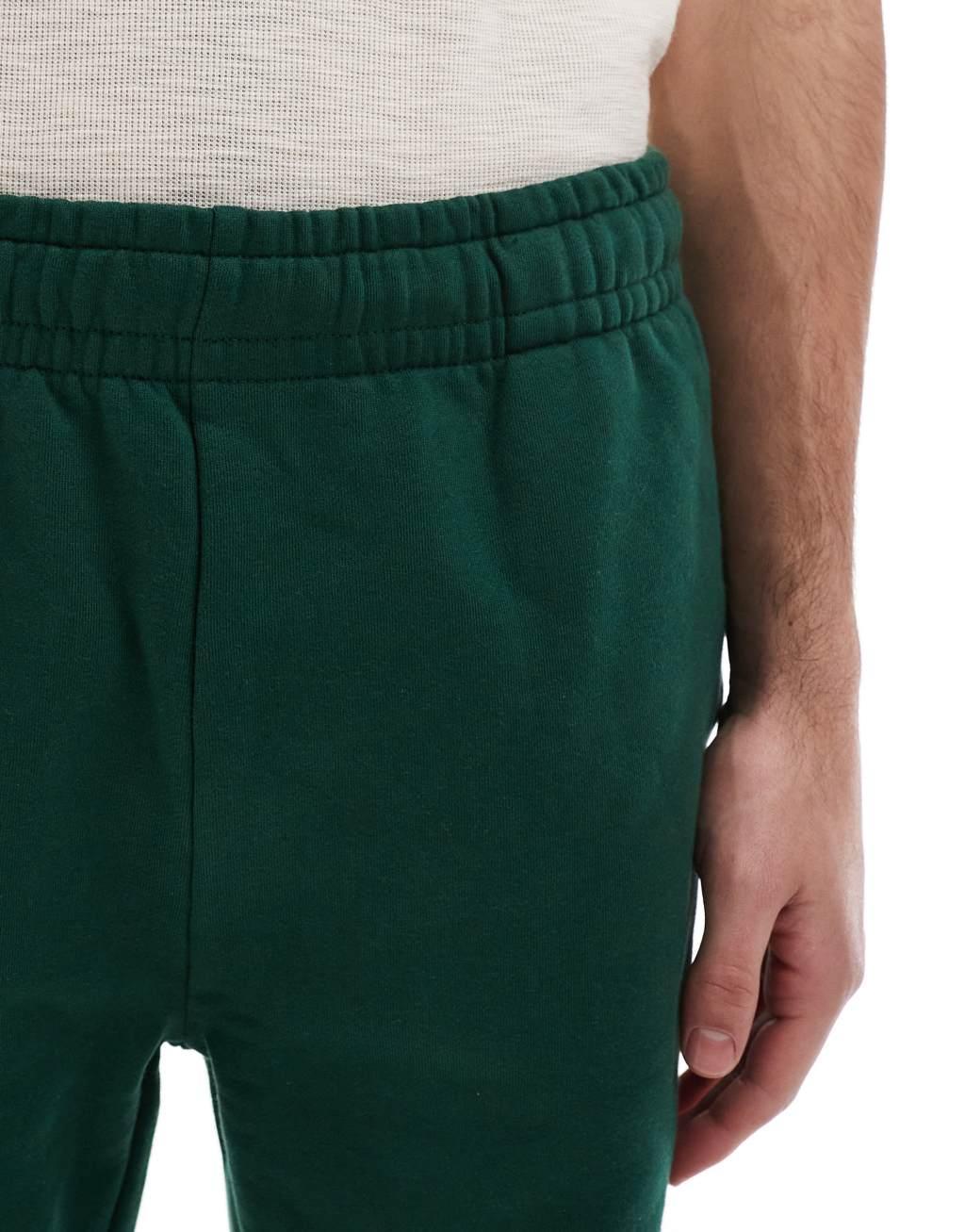 ASOS DESIGN premium heavyweight oversized sweatpants 400gsm in dark green Product Image