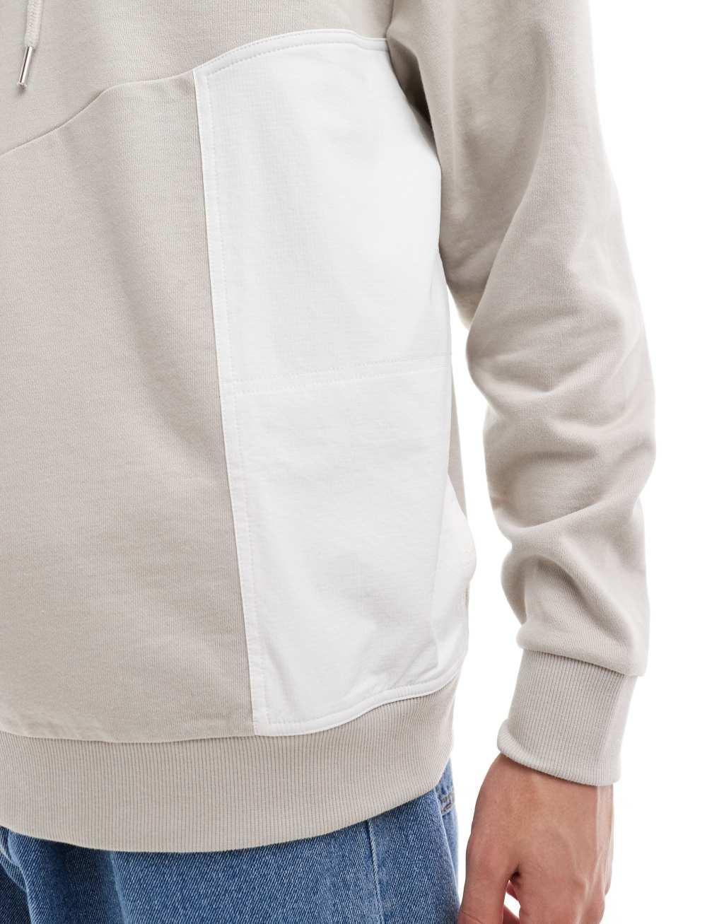ASOS DESIGN oversized hoodie with nylon pocket in beige Product Image