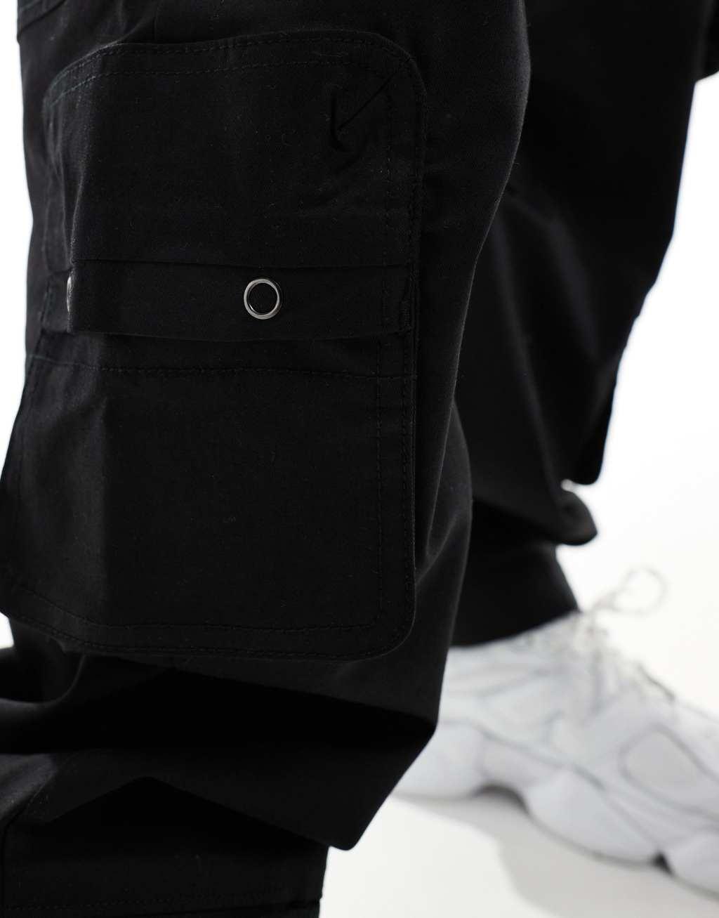 Bershka multi pocket cargo pants in black Product Image