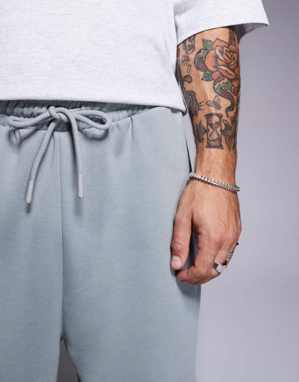 ASOS DESIGN premium heavyweight oversized joggers in light washed gray Product Image