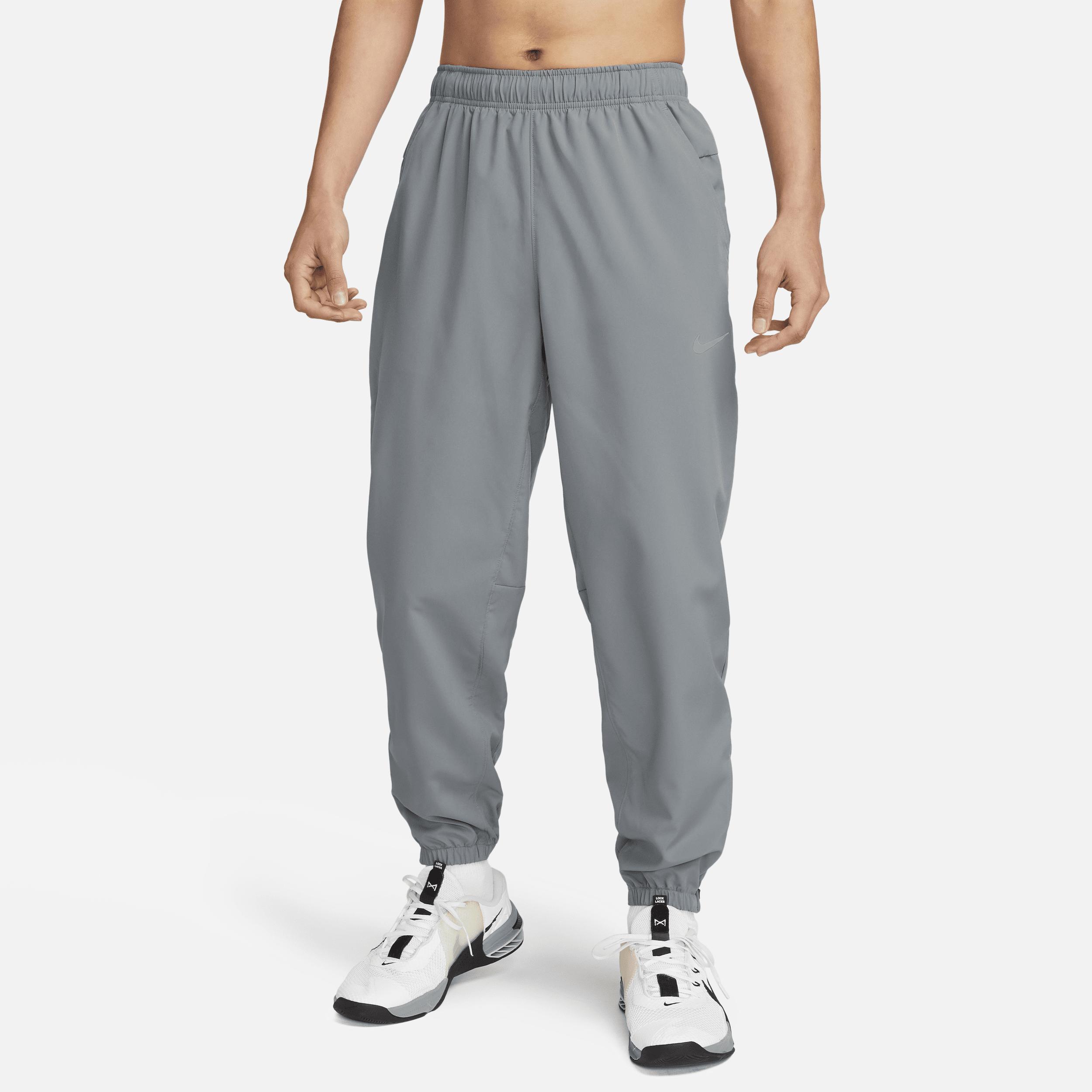 Nike Men's Form Dri-FIT Tapered Versatile Pants in Grey/Smoke Grey Size Large 100% Polyester Product Image