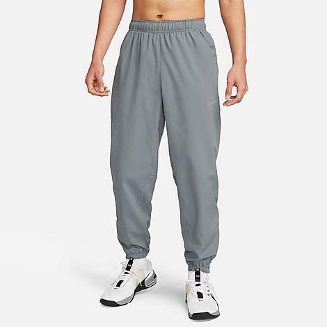 Nike Men's Form Dri-FIT Tapered Versatile Pants in Grey/Smoke Grey Size Large 100% Polyester Product Image