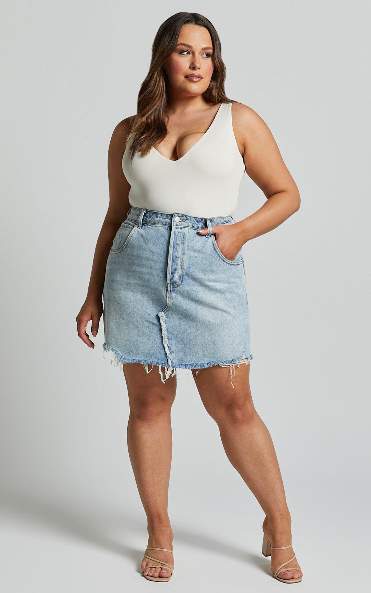 Pieta Mini Skirt - Recycled Cotton Raw Hem Denim Skirt in Mid Blue Wash Product Image