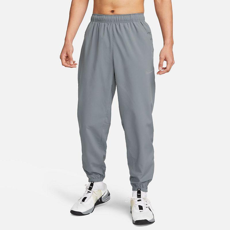 Nike Men's Form Dri-FIT Tapered Versatile Pants in Grey/Smoke Grey Size Large 100% Polyester Product Image
