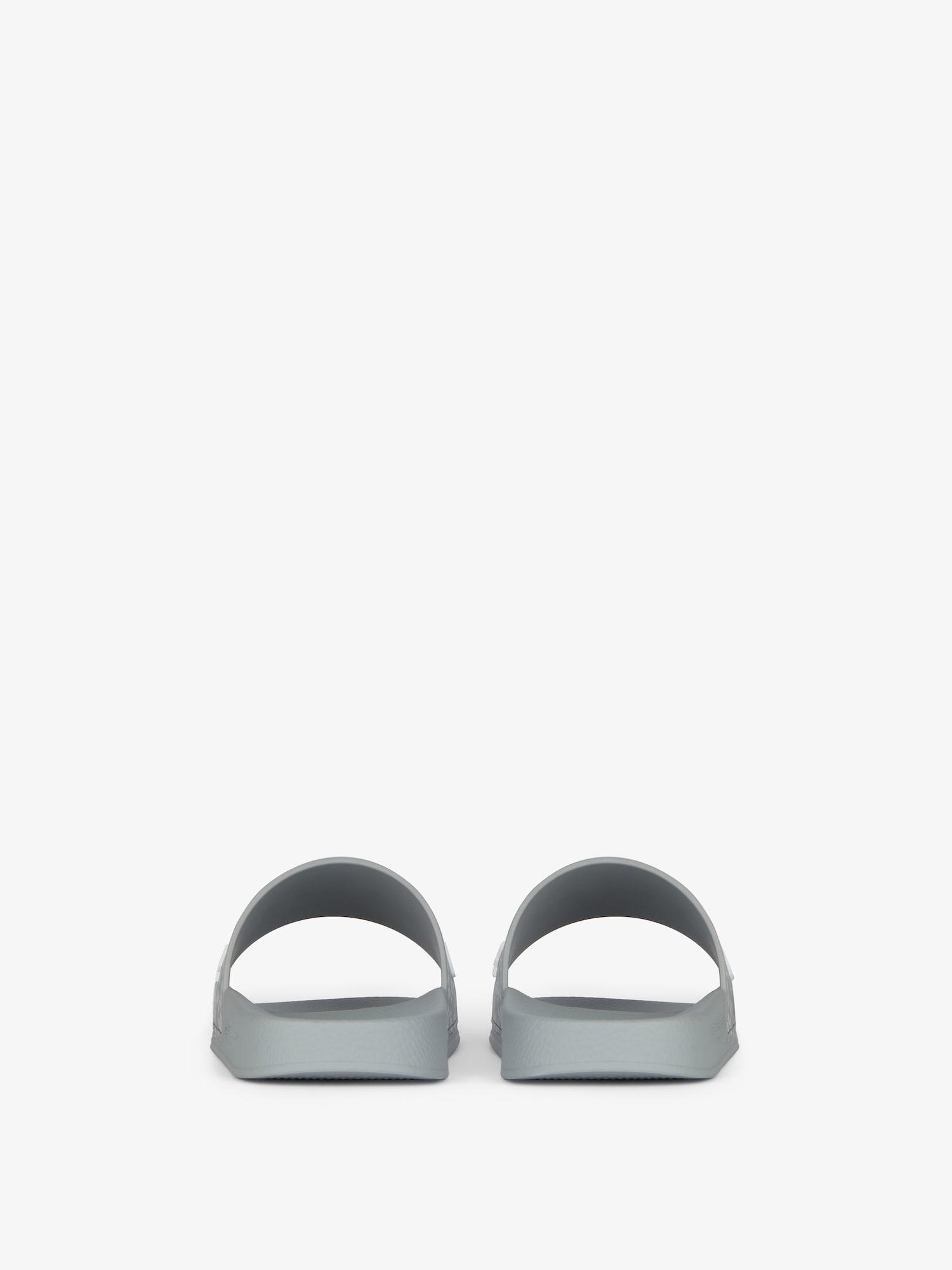 Slide flat sandals in monogram 72 rubber Product Image