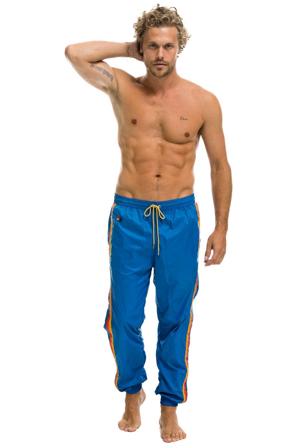 MEN'S 4 STRIPE WIND PANT - SNORKEL BLUE Male Product Image