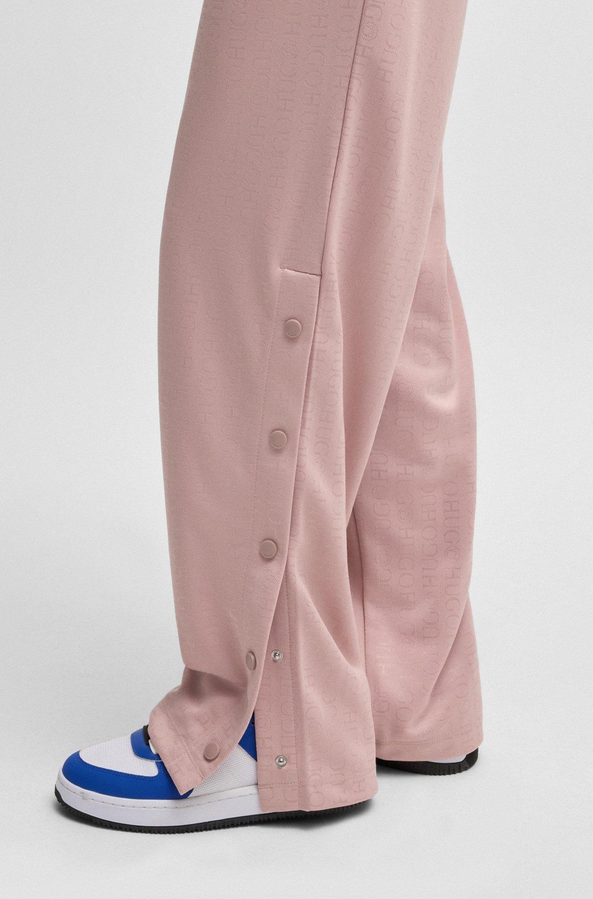 HUGO - Oversize-fit tracksuit bottoms with logo jacquard - Patterned Product Image