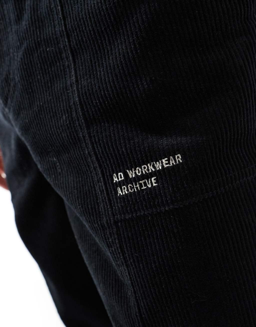 ASOS DESIGN baggy corduroy pants with embroidered patch in black Product Image