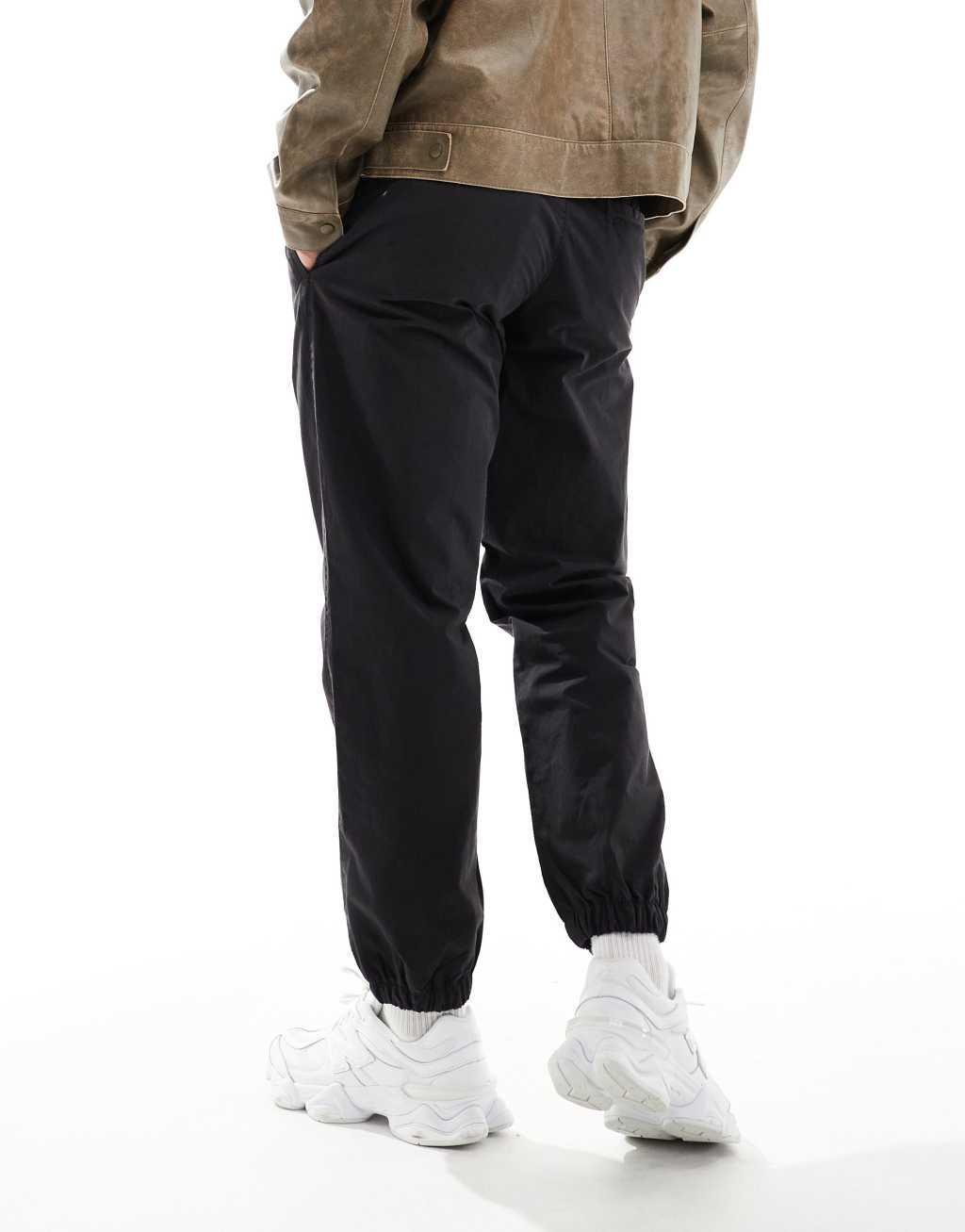 ASOS DESIGN tapered pull on pants in washed black Product Image