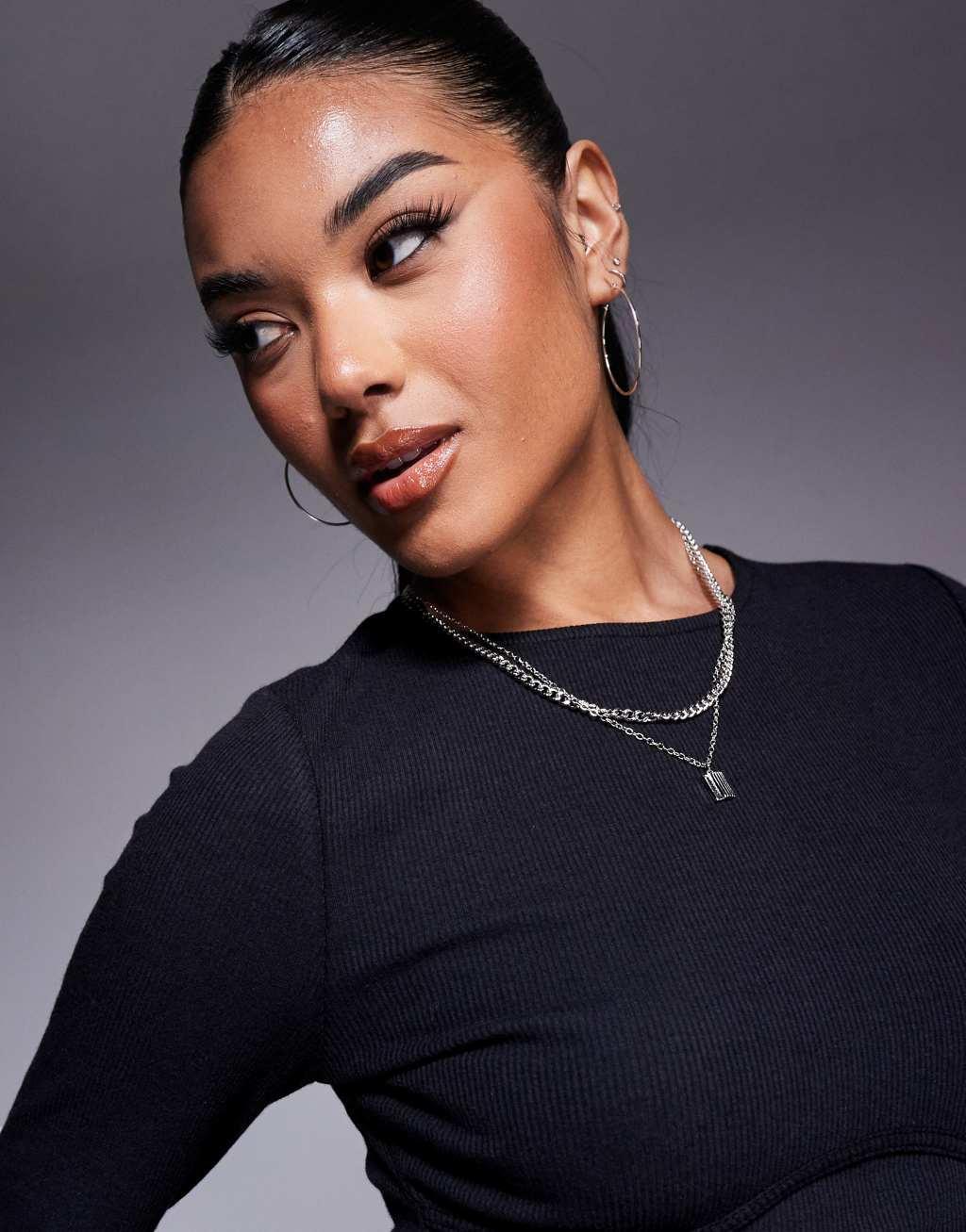 ASOS DESIGN ribbed long sleeve under bust seam detail top in black Product Image