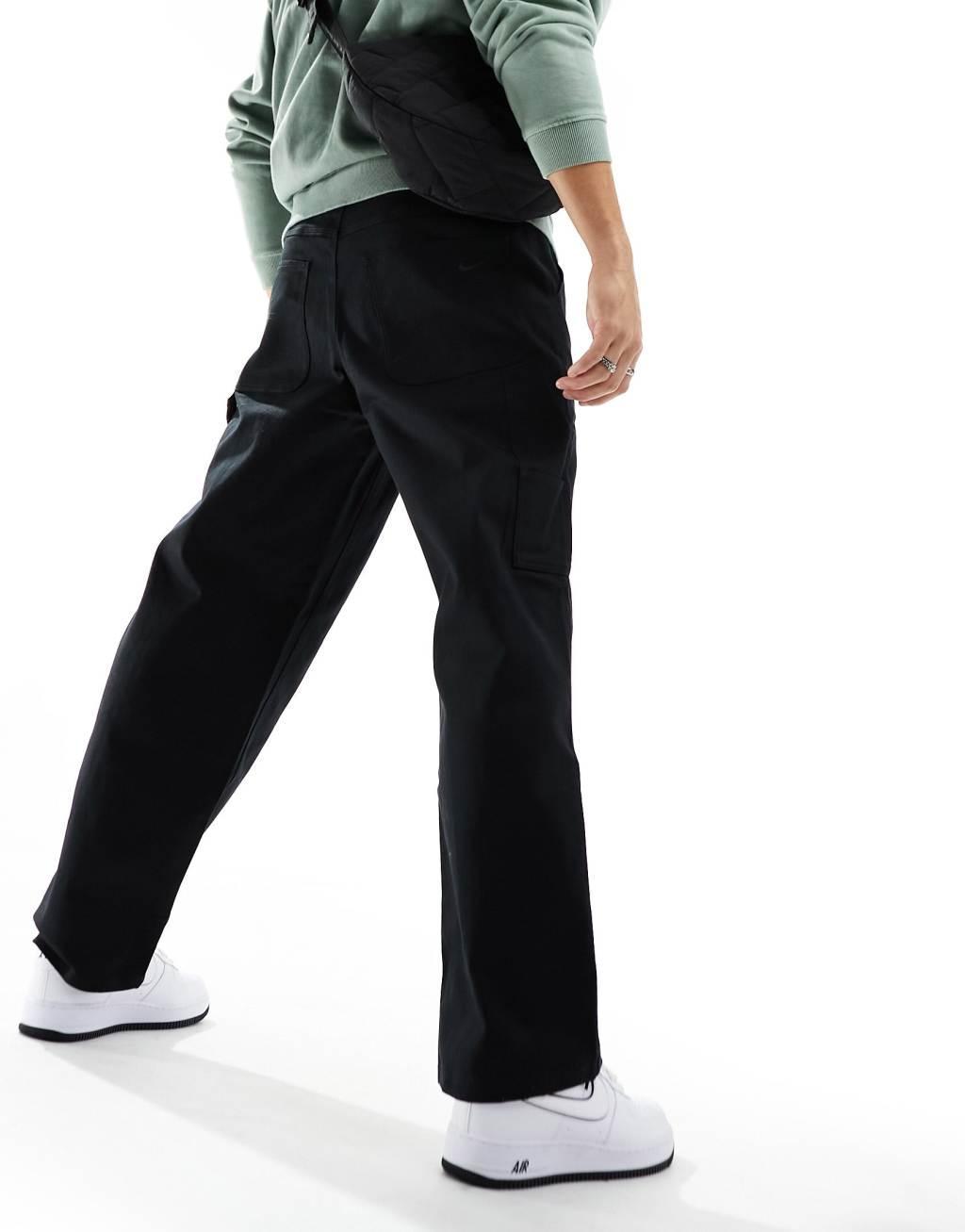 Nike Life Carpenter pants in black Product Image
