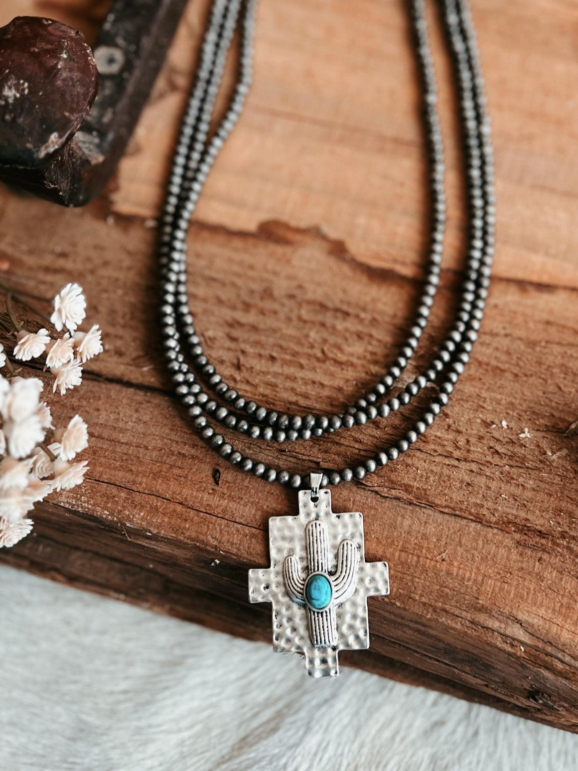 Multi-Strand Navajo Pearl Strand Necklace With A Cactus Pendant Product Image