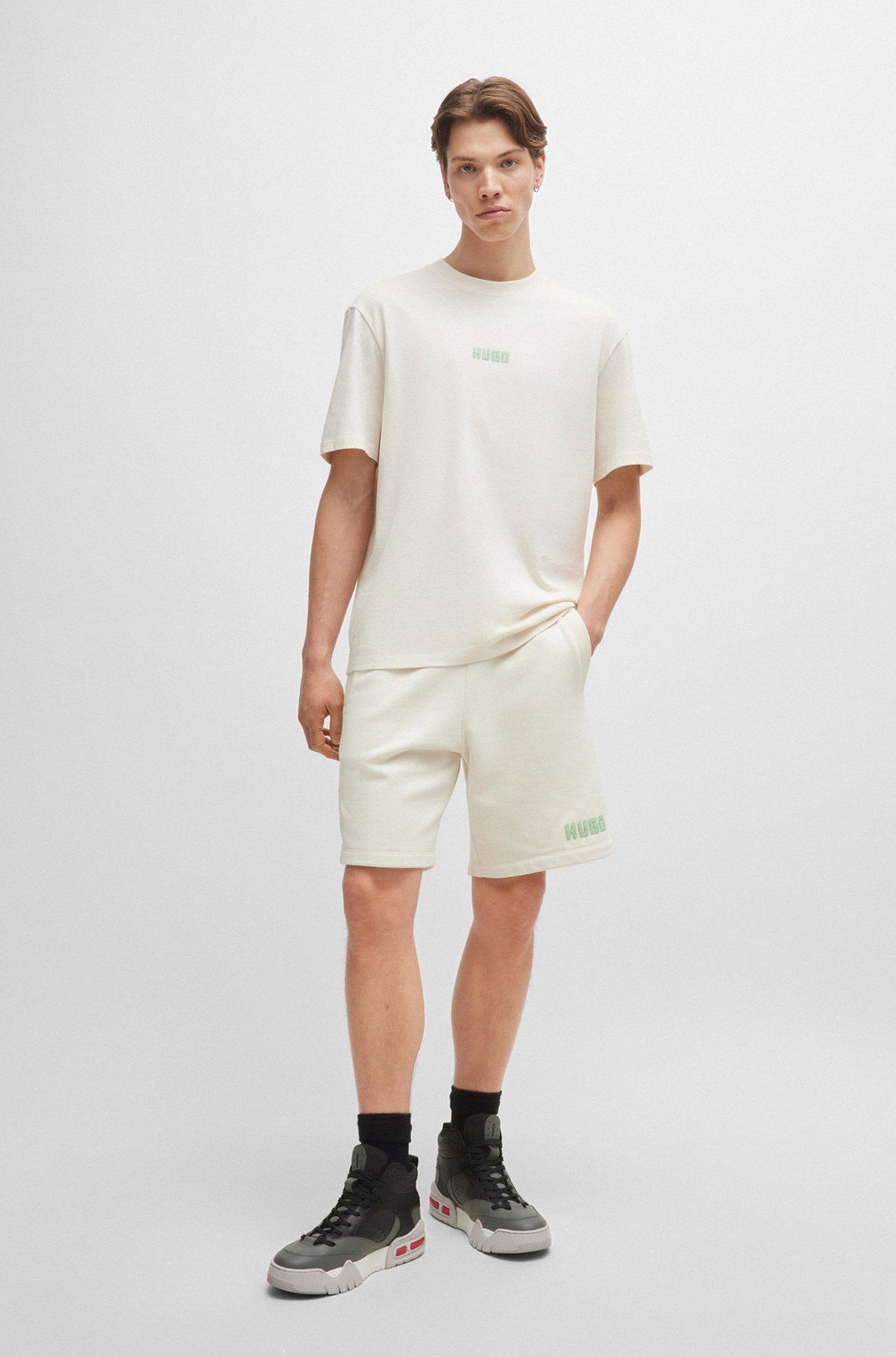 Relaxed-fit T-shirt in cotton with large rear logos Product Image