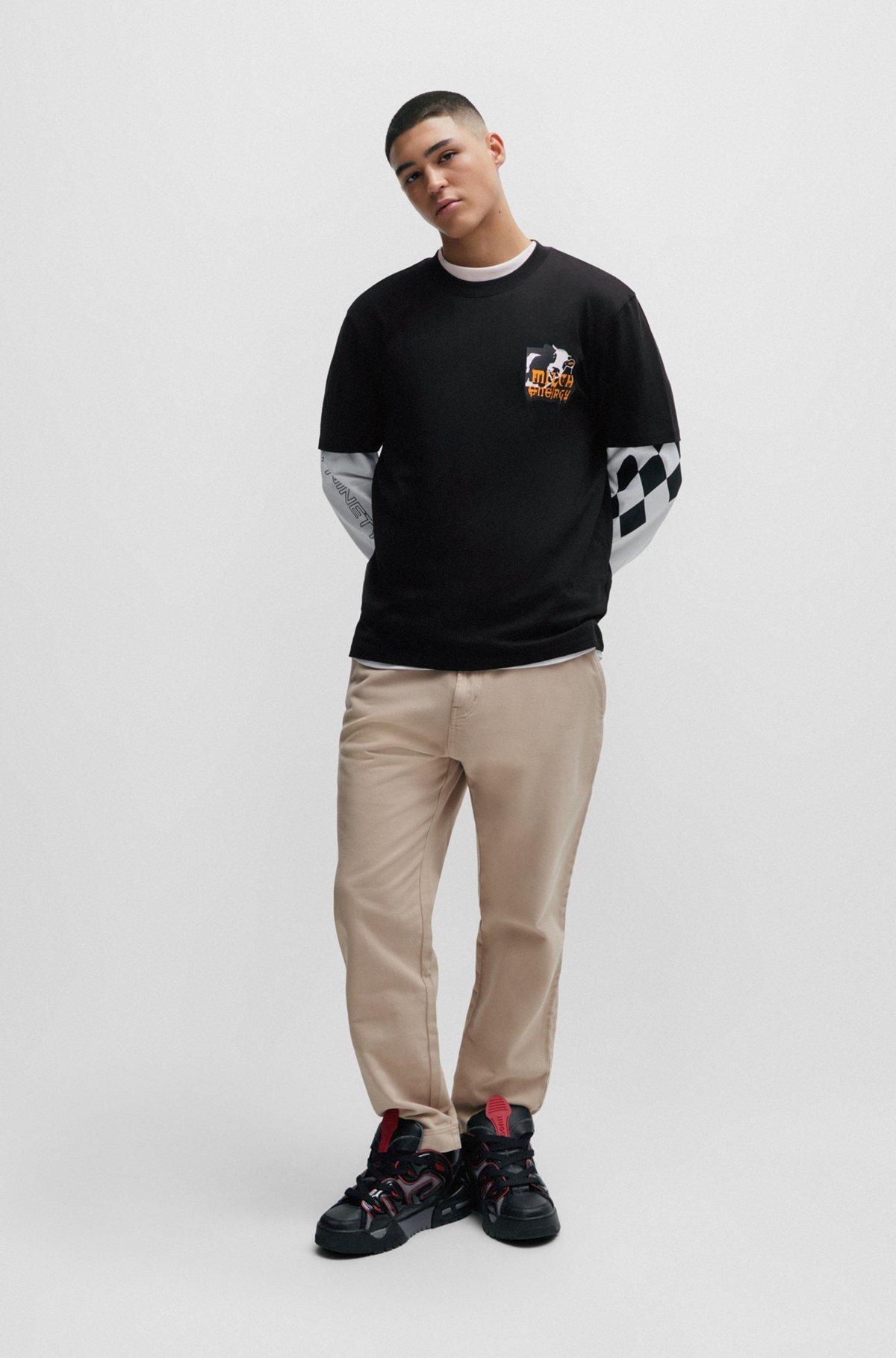 HUGO - Relaxed-fit T-shirt in with seasonal artwork - Black Product Image
