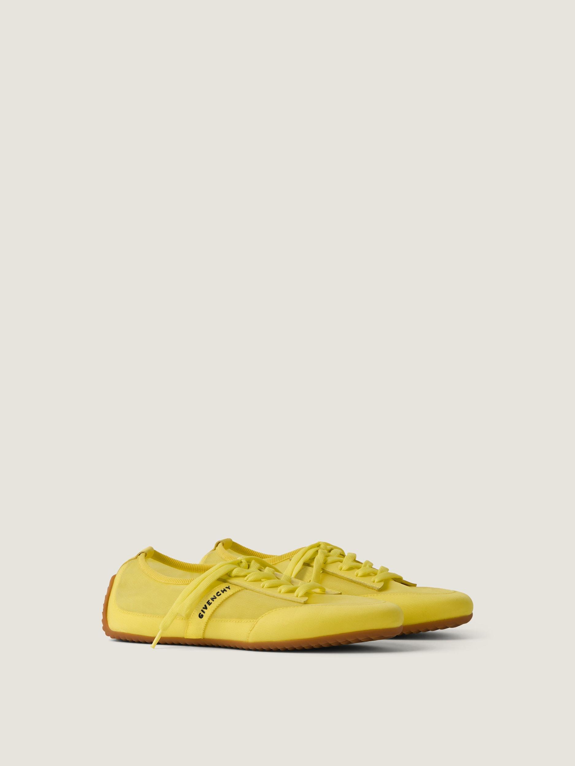 Slim sneakers in transparent mesh and leather Product Image
