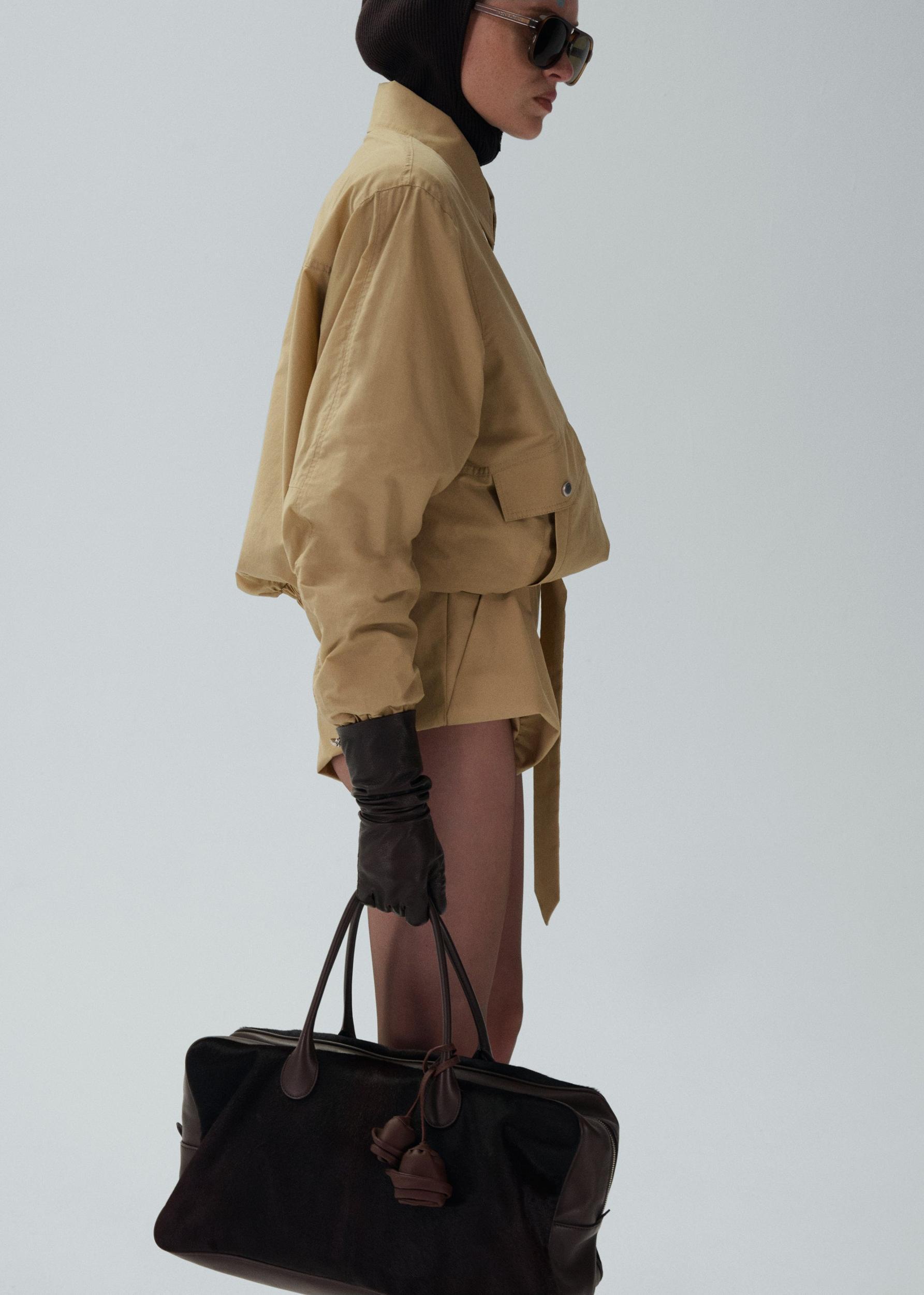 Flared wool shorts in beige Product Image