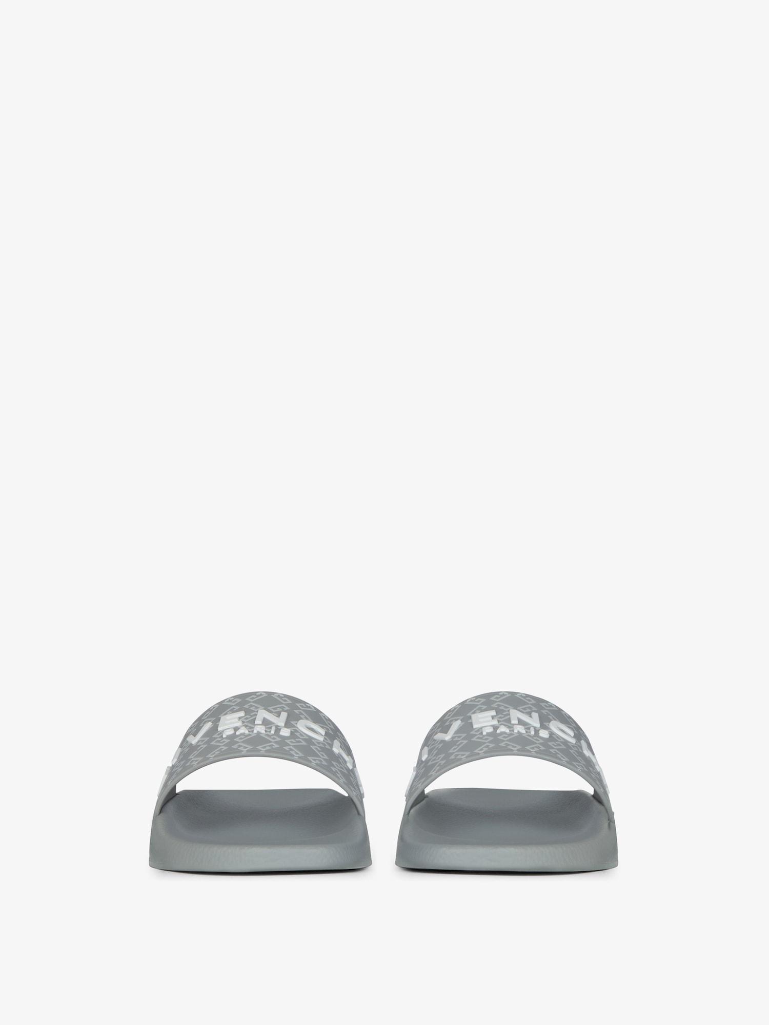 Slide flat sandals in monogram 72 rubber Product Image