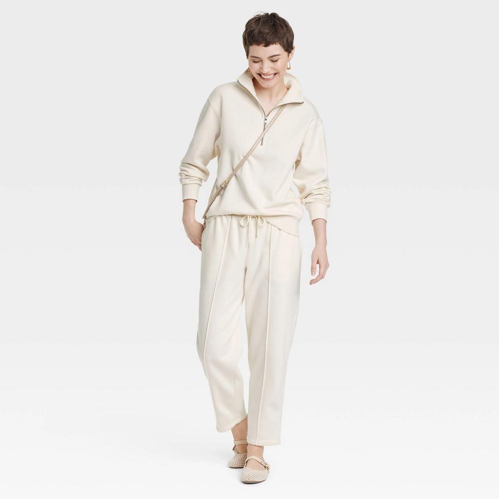 Women's Leisure Studio Quarter Zip Pullover Sweatshirt - Universal Thread™ Cream M Product Image