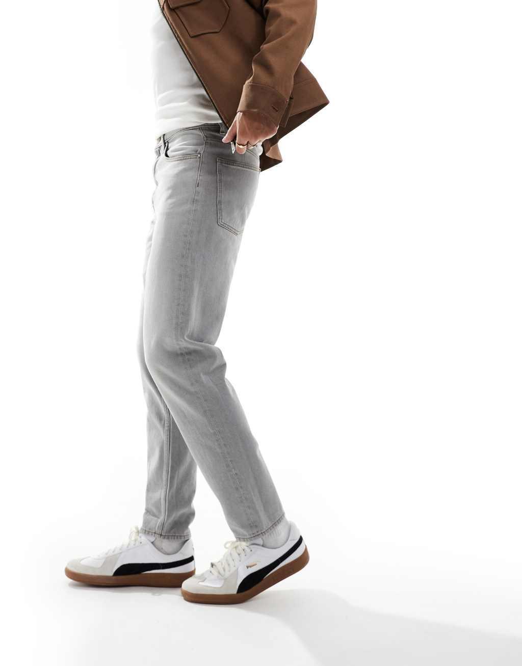 ASOS DESIGN tapered fit jeans in light gray Product Image