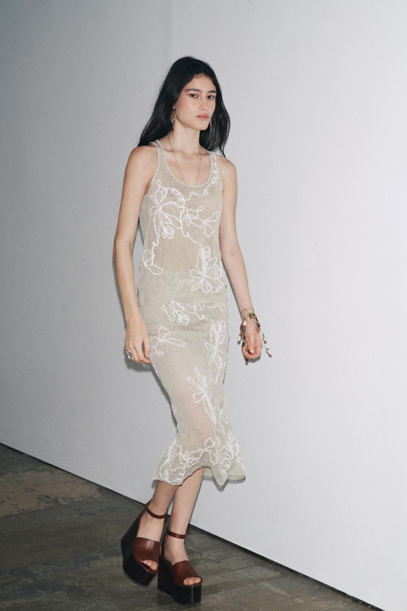 SEMI-SHEER STRUCTURED KNIT TOP Product Image