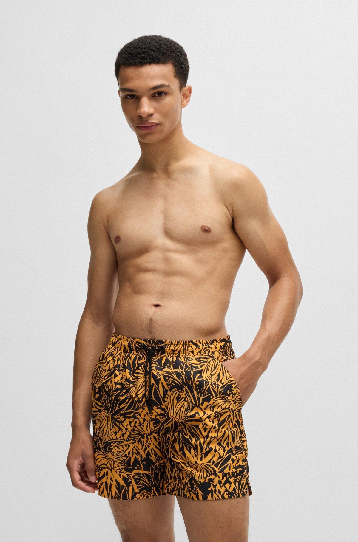 HUGO - Fully lined swim shorts with seasonal print - Black Product Image