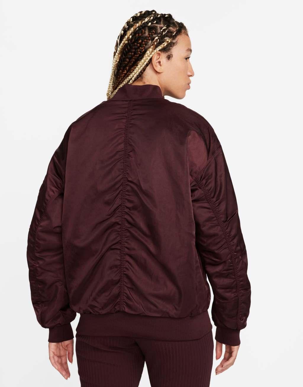 Nike Road To Wellness bomber jacket in burgundy Product Image