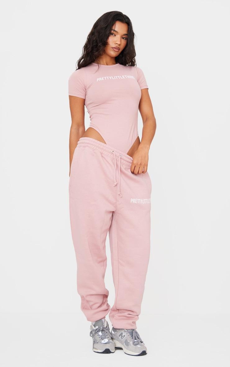 PRETTYLITTLETHING Light Pink Logo Short Sleeve Bodysuit Product Image