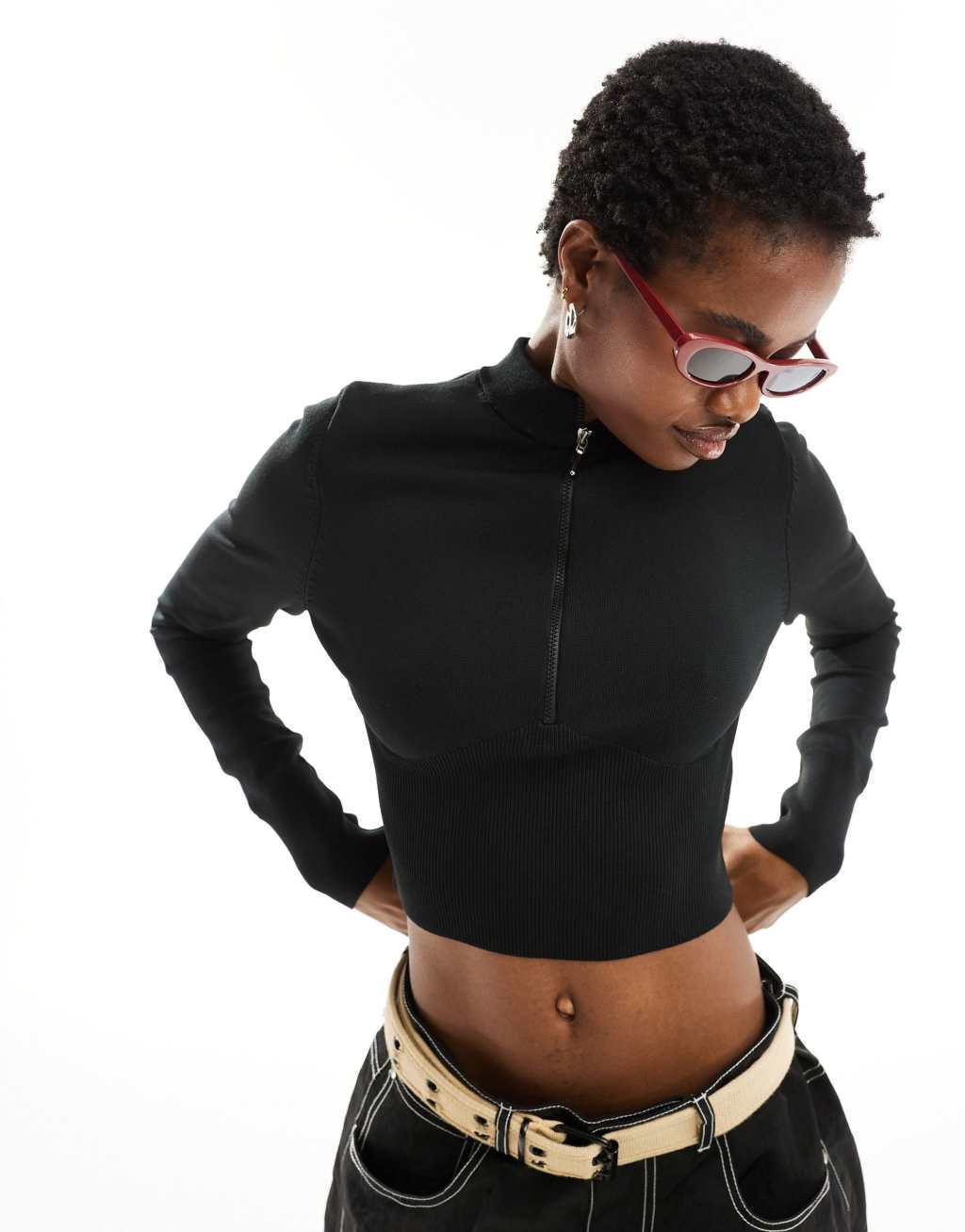 Nike Chill Knit 3/4 zip top in black Product Image