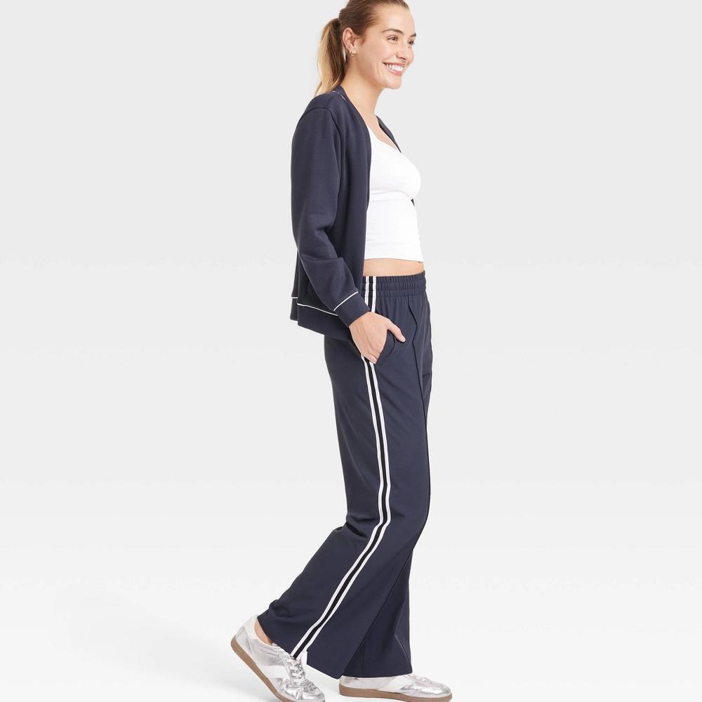 Womens Woven High-Rise Track Pants - All In Motion Dark Blue S: Recycled Polyester, Spandex, Moisture Wicking, Quick Drying Product Image