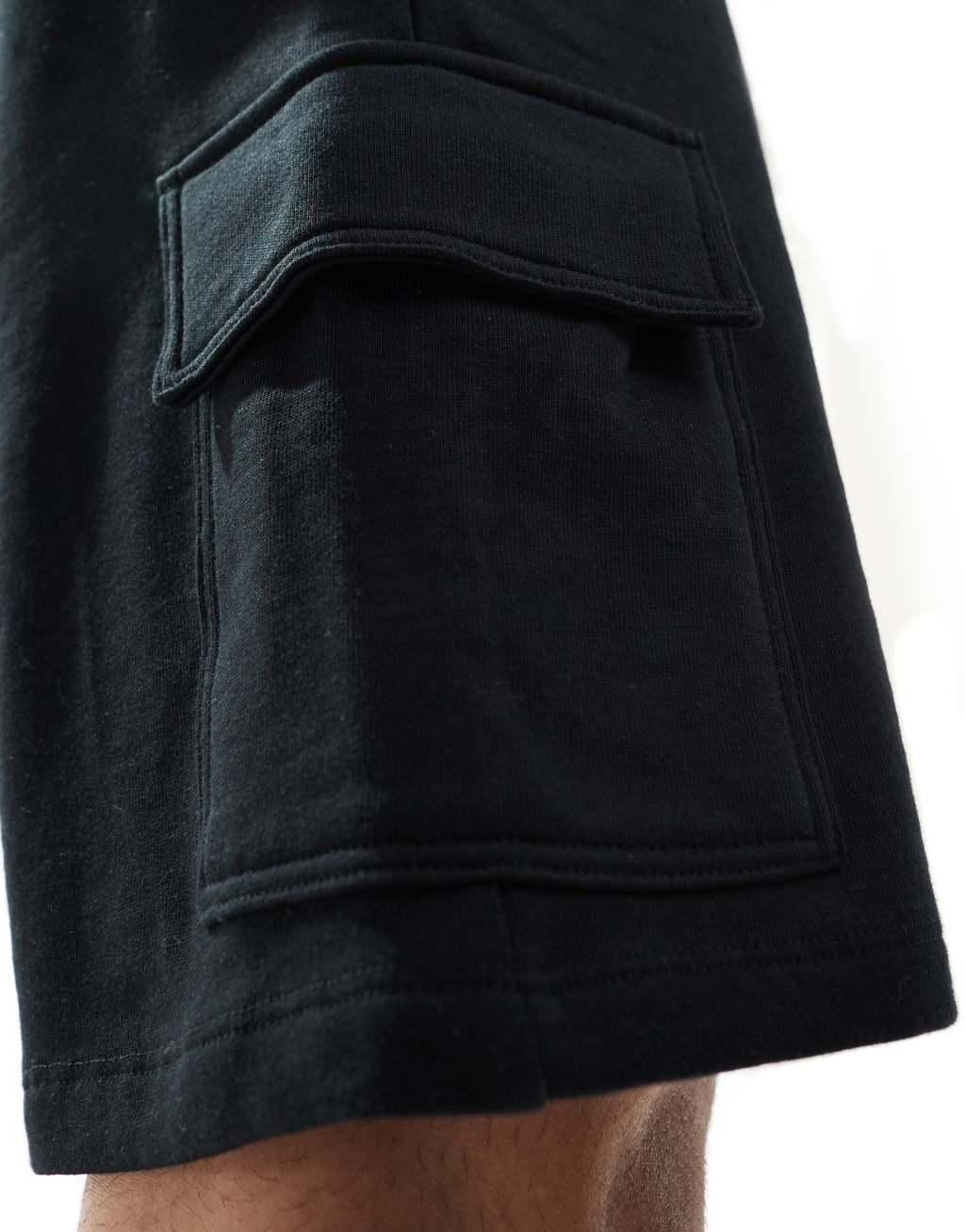 ASOS DESIGN slim shorts with cargo pocket in black Product Image