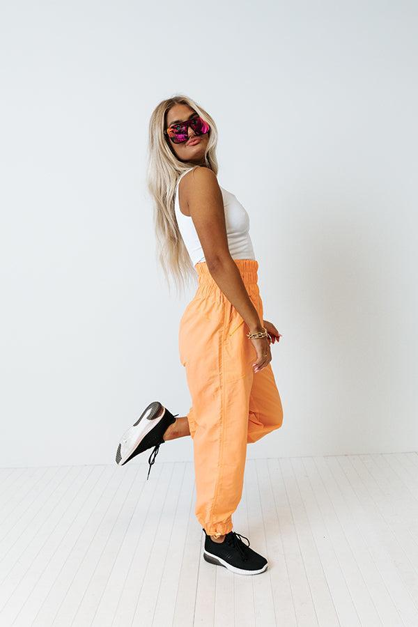 The Huxley High Waist Windbreaker Pants In Neon Orange Product Image